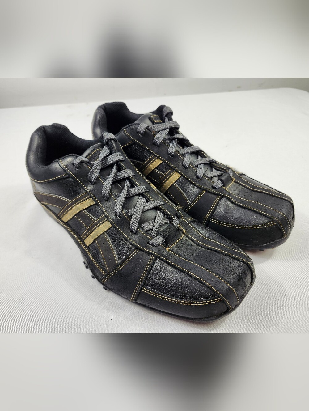 Skechers Mens 10 M Black Leather Athletic Sneakers with Gold Stripes Shoes